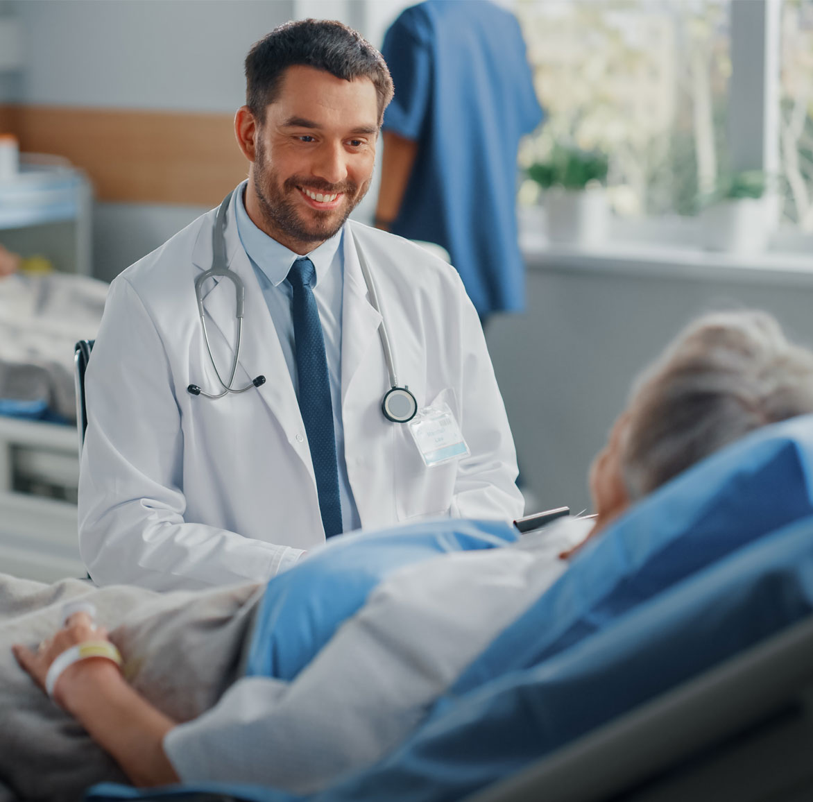 Surgeon speaking with a patient.