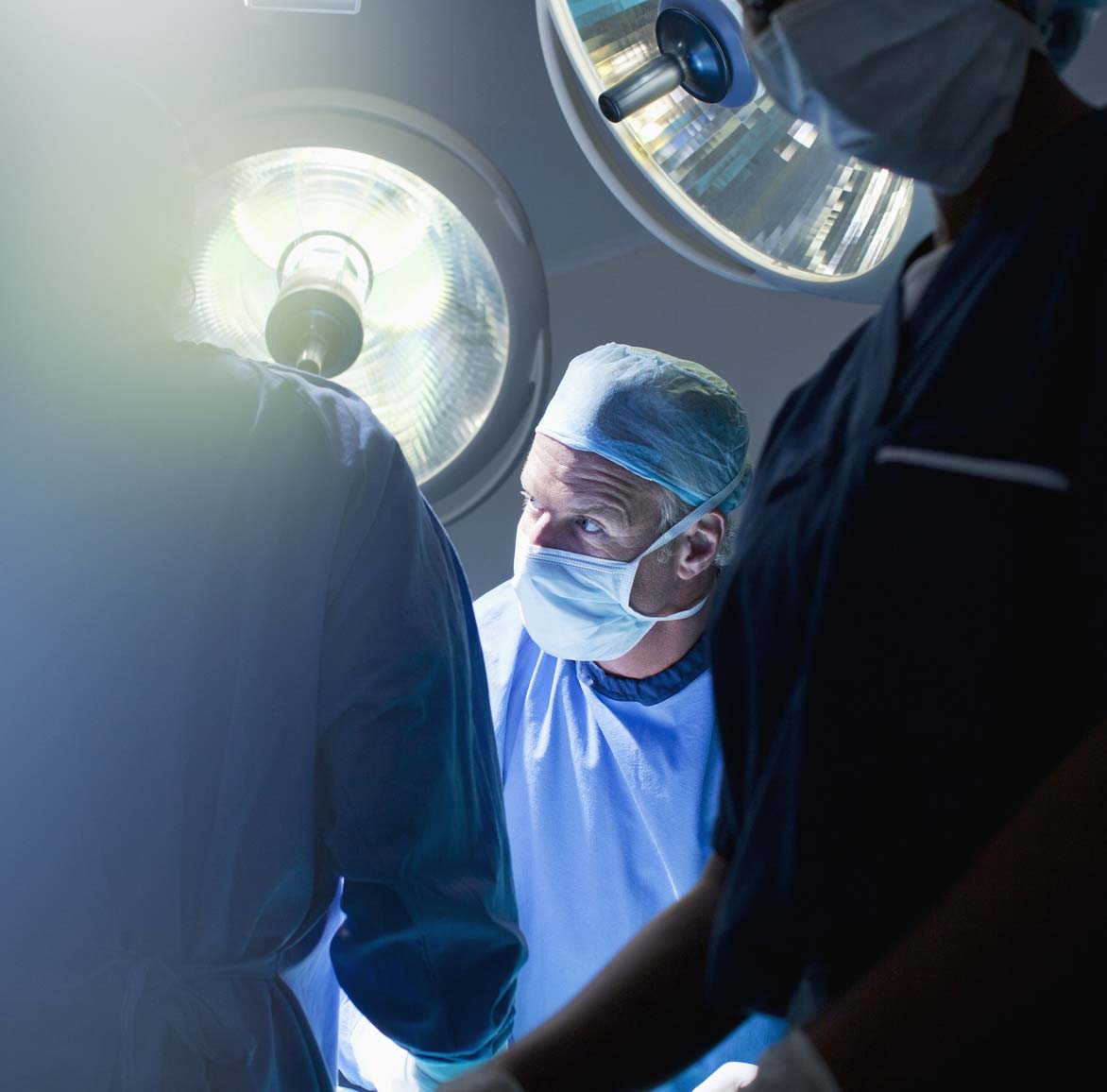Surgeon performing a surgery.